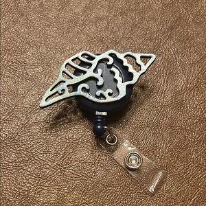 Blue, Greeb and Black Sea Shell Badge Reel